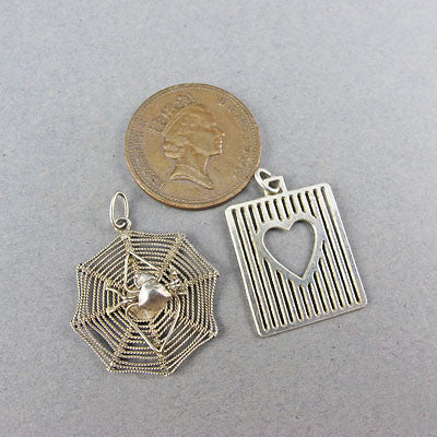 2 vintage silver pendants