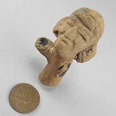 Ancient artifact near east clay figure