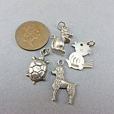 4 Vintage silver  jewellery charms