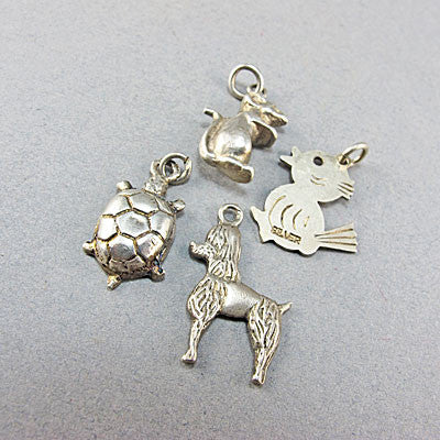 4 Vintage silver jewellery  charms